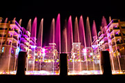 Colorful fountains and lights adorn the nightlife of Branson Landing