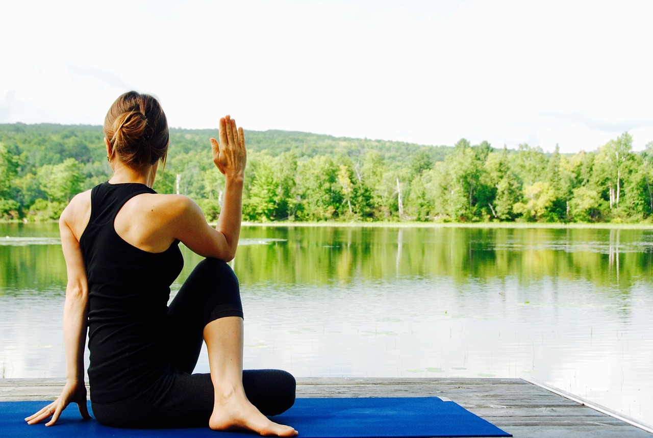 A woman enjoying yoga in Branson MO by the lake